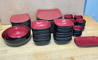 Full set showing stacks of plates, bowls, ramekins and rectangular platter