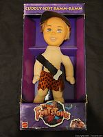 Front view of boxed Bamm-Bamm plush doll