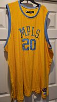Full front view of yellow MPLS #20 jersey on hanger