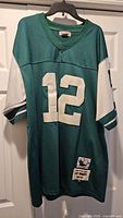 Front view showing full jersey, number 12, and overall condition