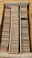 Full box with three rows of football cards