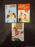 Front covers of the three comic books