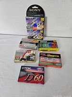 All six sealed cassette packages grouped