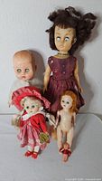 Group shot of all five dolls upright