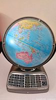 Full view of globe on base showing continents and overall condition