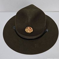 Front view of olive drab campaign hat with gold eagle insignia