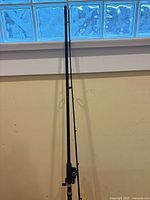 Full view of Shimano Triton rod leaning against wall