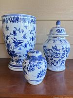 Front view of all three porcelain pieces showing patterns and scale