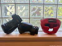 Gloves and headgear on windowsill