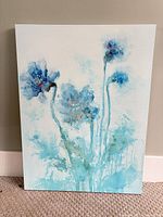 Front view of unframed acrylic painting showing blue-teal floral abstract design