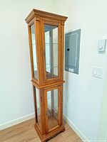 Full view tall curio cabinet front and side