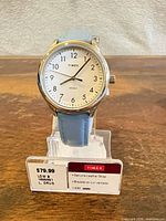 Front view of Timex watch on retail stand