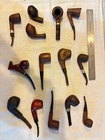 Group view of all 14 pipes with ruler for scale