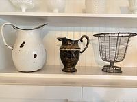 white enamel pitcher, metal pitcher, wire basket on shelf
