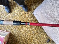 Handle section showing cork grip, reel seat, and blank color