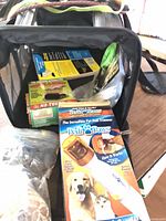 Carrier open showing interior contents including PediPaws box and supplies