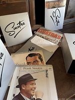Open view showing several album sleeves, outer box lids, Sinatra branding visible