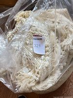 Afghan in plastic bag showing color and fringe