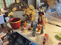 Overall lot view showing wreath, drum, nativity figures and angel
