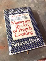 Front cover of Mastering the Art of French Cooking Volume Two showing wear to dust jacket