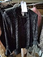 Full view of R & M Richards metallic patterned jacket on hanger