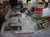 Overview showing sheet protectors, colored pencils, eraser, paper clips, tape, loose papers