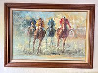 Frontal view of framed painting showing entire artwork with four jockeys