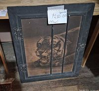 Front view of framed tiger artwork showing image, frame and metal hinges