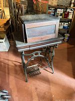 Machine closed in cabinet on cast iron base