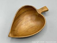 Top view of acacia leaf bowl showing interior grain and handle