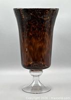 Full view of vase showing tortoise-shell pattern and flared rim