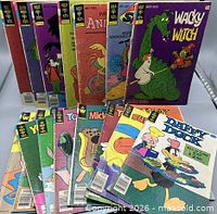 All 22 bagged Gold Key comics fanned out showing variety of titles