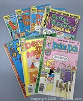 All seven comics fanned out showing titles