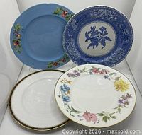 Group shot of four vintage 10.5" plates showing patterns and colours