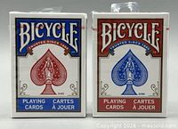 Front view of both sealed Bicycle decks showing red and blue fronts