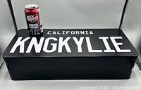 Top view showing Dr Pepper can for scale and full CALIFORNIA KNGKYLIE text