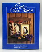 Front cover of Cats in Cross Stitch book