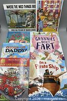 Seven children's books laid out showing all covers