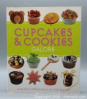 Front cover showing title and cupcake images