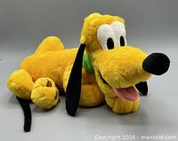 Pluto plush toy angled front view showing face, collar, paws