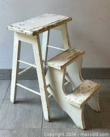 Front angle showing stool and retracted steps