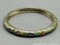 Full view of green enamel floral hinged bangle