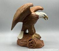 Left side view of handpainted bisque eagle on log base