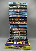 Entire 14-book lot stacked showing spines