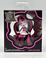 Front view of boxed Draculaura vinyl figure