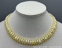Front view of entire beaded collar necklace displayed on form
