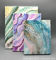 Front view showing all three abstract paintings together