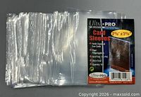 Stack of clear sleeves with Ultra Pro packaging front card