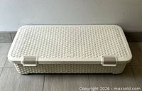 Closed cream Curver storage box showing wicker texture and latches