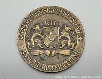 Obverse of medal showing university name, coat of arms, Latin inscription